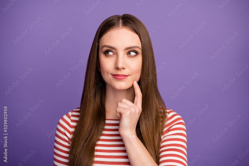 Closeup photo of attractive funny lady long hairstyle intelligent student look interested side empty space arm on chin wear casual striped shirt isolated pastel purple color background Closeup photo of attractive funny lady long hairstyle intelligent student look interested side empty space arm on chin wear casual striped shirt isolated pastel purple color background