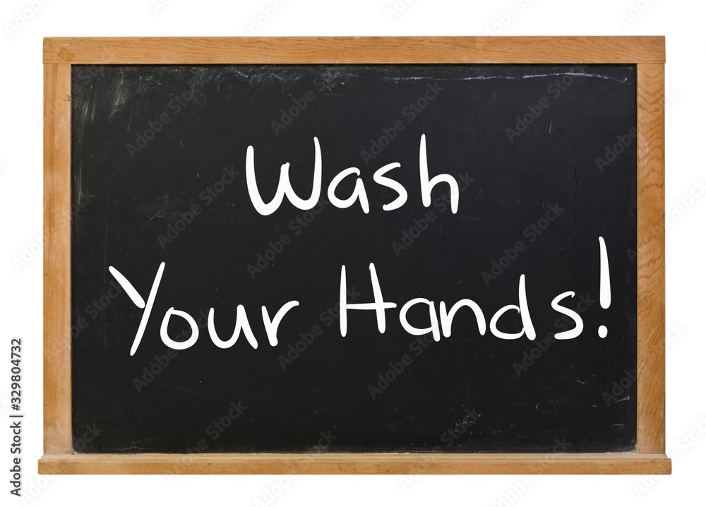 Wash your hands written in white chalk on a black chalkboard isolated on white Wash your hands written in white chalk on a black chalkboard isolated on white