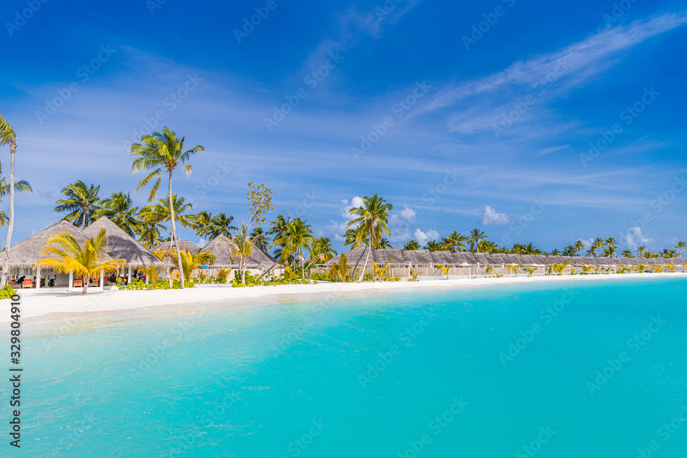 Amazing Maldives island panorama. Beautiful beach scene with palm trees and perfect blue sea water. Relaxing and exotic tropical landscape view. Luxury summer vacation and holiday banner concept
