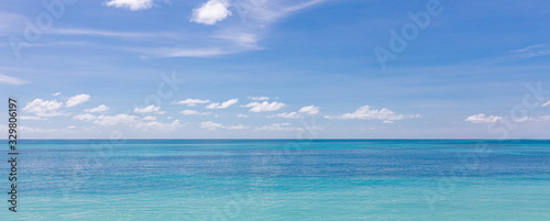 Relaxing seascape with wide horizon of the sky and the sea. Calm ocean water