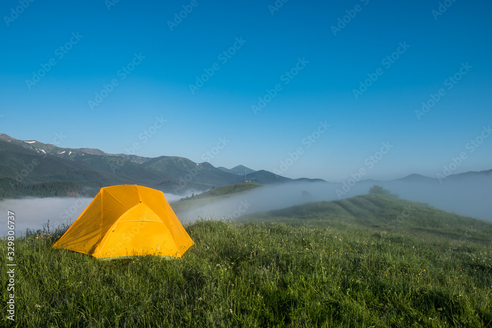 Tourist camping tent in a mountains. Carpathian, Ukraine, Europe. Beauty world.