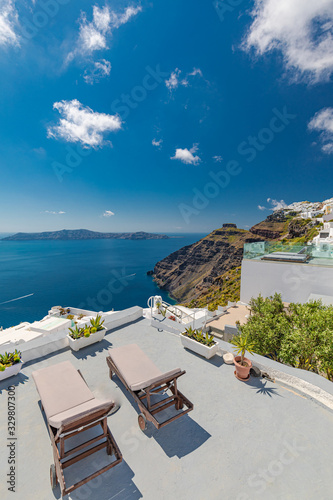 Wonderful scenery of white architecture and blue sea view of Santorini island. Picturesque spring sunrise on the famous Greek resort Thira, Greece, Europe. Traveling concept background.