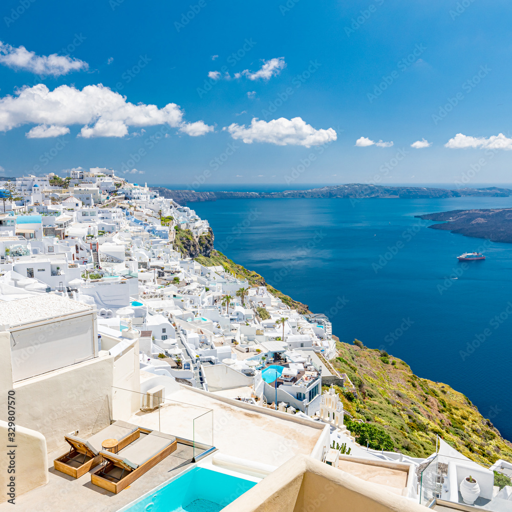 Santorini, Greece. Famous view of traditional white architecture Santorini landscape with blur sea in foreground. Summer vacations background. Luxury travel tourism concept. Amazing summer destination