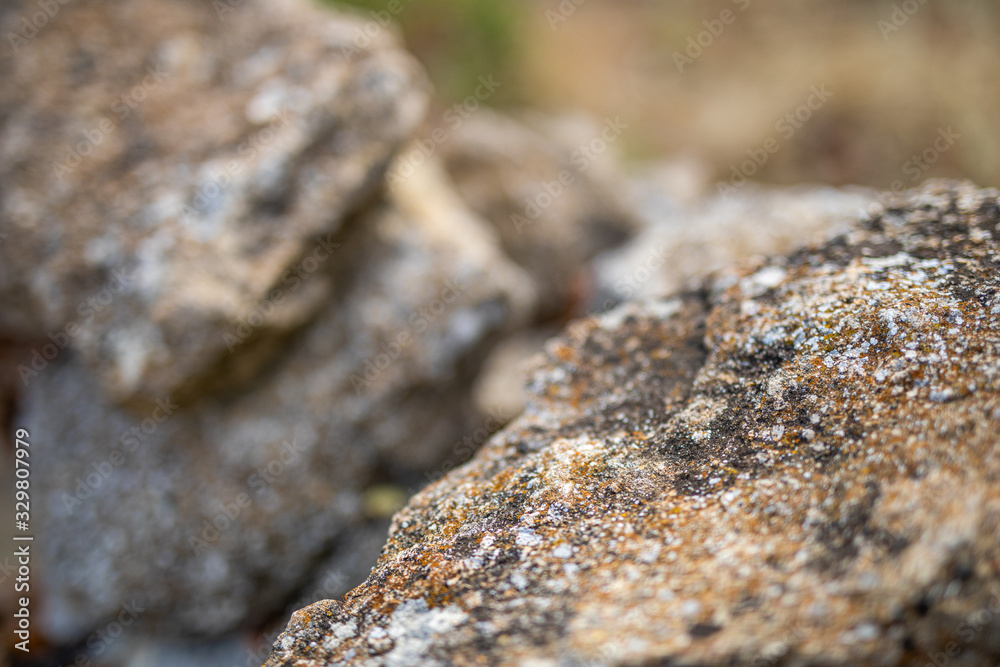 Natural closeup view of rock texture as stone wall brick, wall tiles made of natural stones Natural closeup view of rock texture as stone wall brick, wall tiles made of natural stones