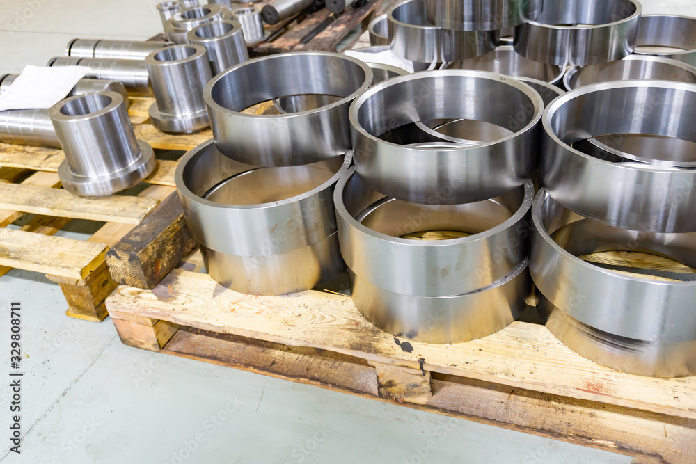 Large metal rings on a wooden shelf, after turning. Large metal rings on a wooden shelf, after turning.