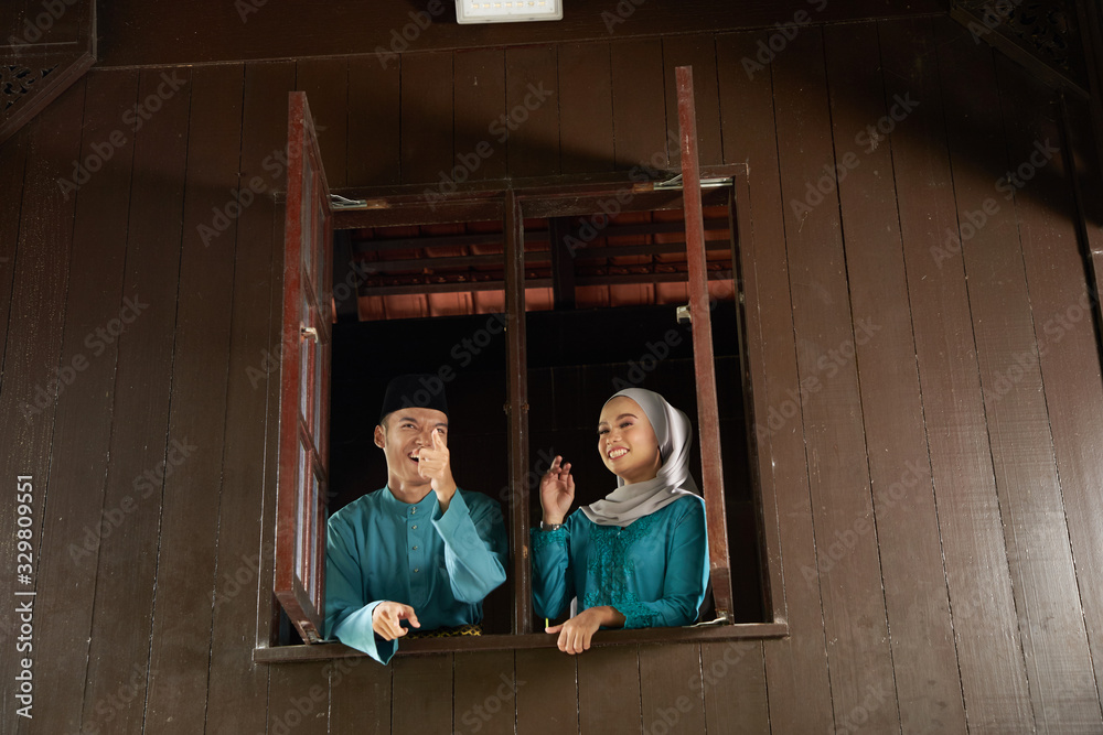 couple at the wooden window