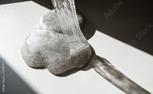glitter slime transparent flexible viscous. game for children. antistress. beautiful background