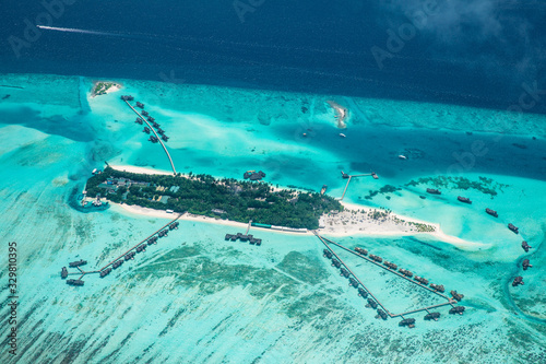 Tropical islands and atolls in Maldives from aerial view. Aerial view of Maldives island and blue ocean background