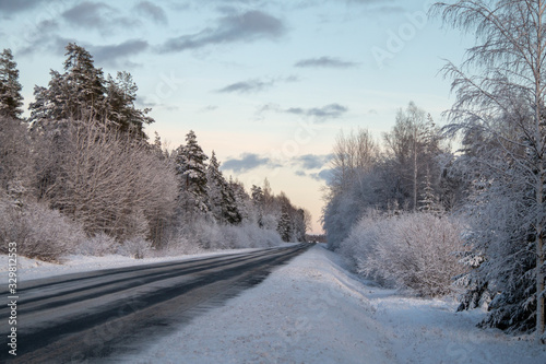 Winter country road in snowy winter day