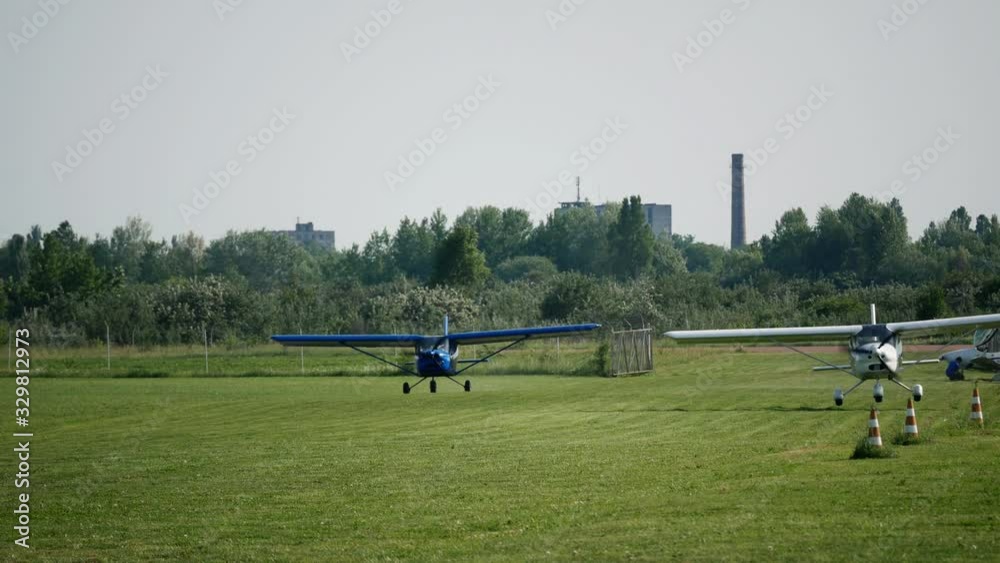 Ultralight small private aircraft airplanes take off on the airfield. Aviation festival holiday at the aerodrome airport 