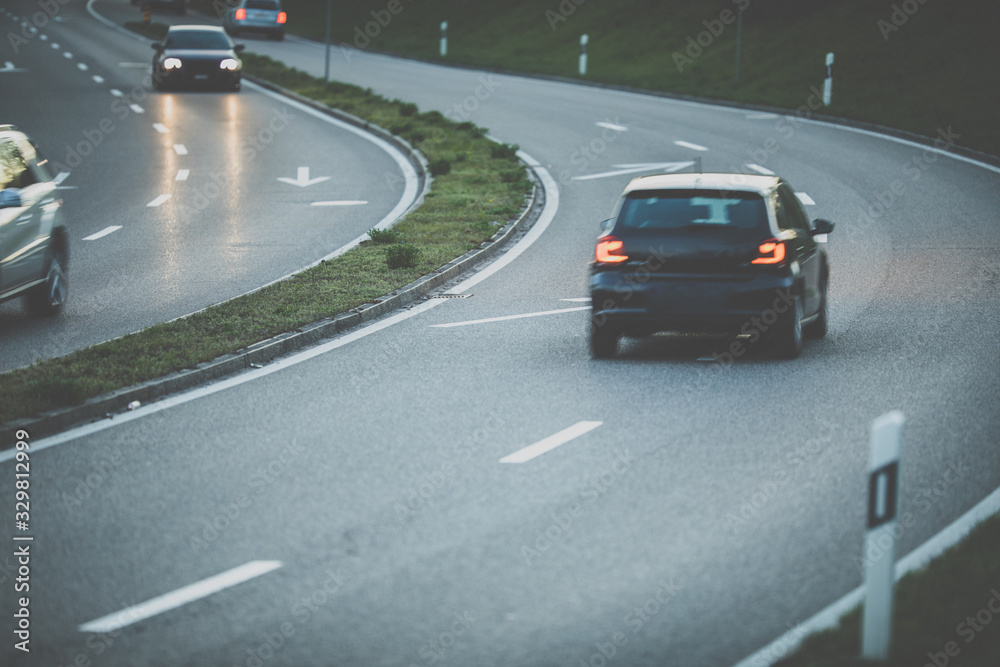 Fototapeta premium Cars on a highway at night (shallow DOF; color toned image)