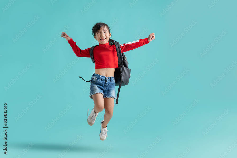 Asian schoolgirl is jumping. she is happy. Asian schoolgirl is jumping. she is happy.