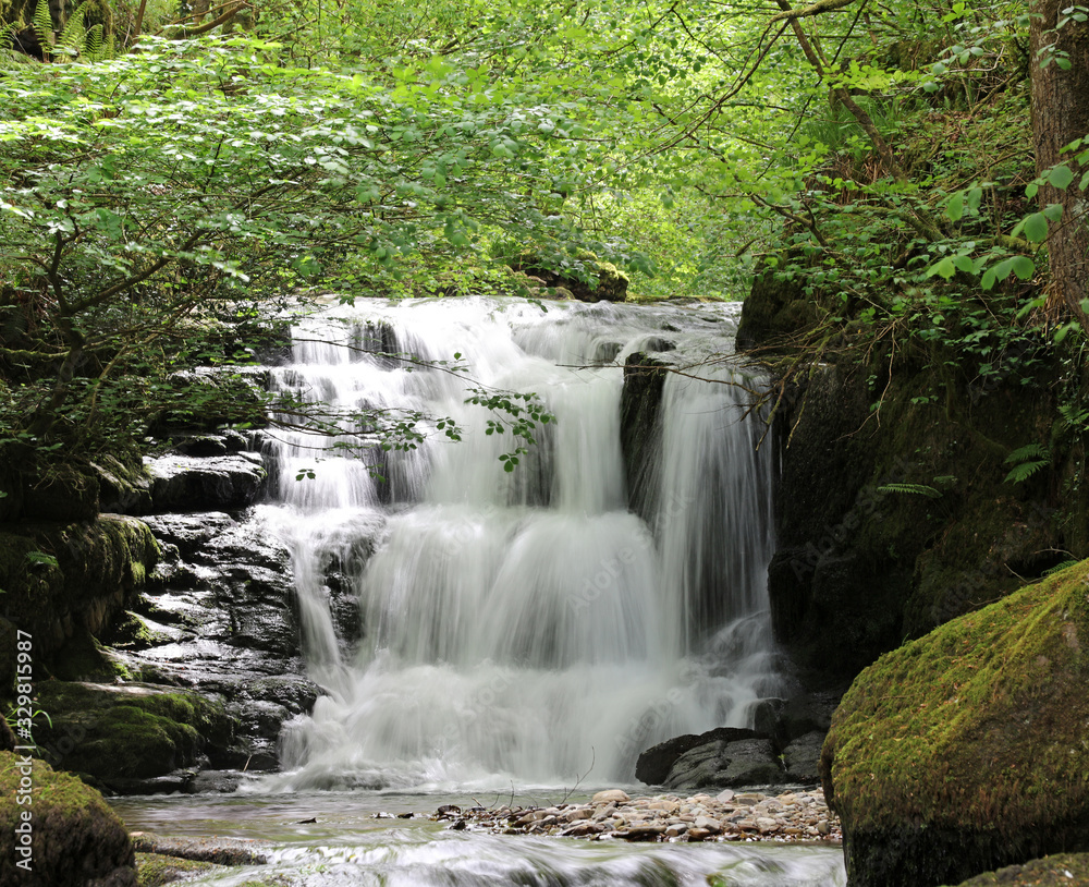 Obraz premium Waterfall at Hoar Oak Water, Watersmeet Devon