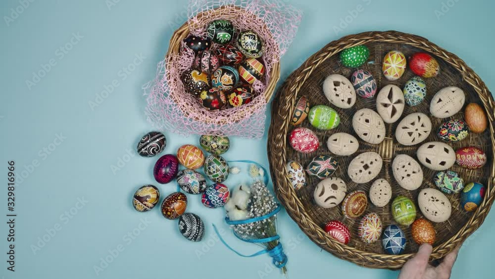 Hands holding basket with easter eggs near basket on blue background. Easter is holy. 4k Hands holding basket with easter eggs near basket on blue background. Easter is holy. 4k