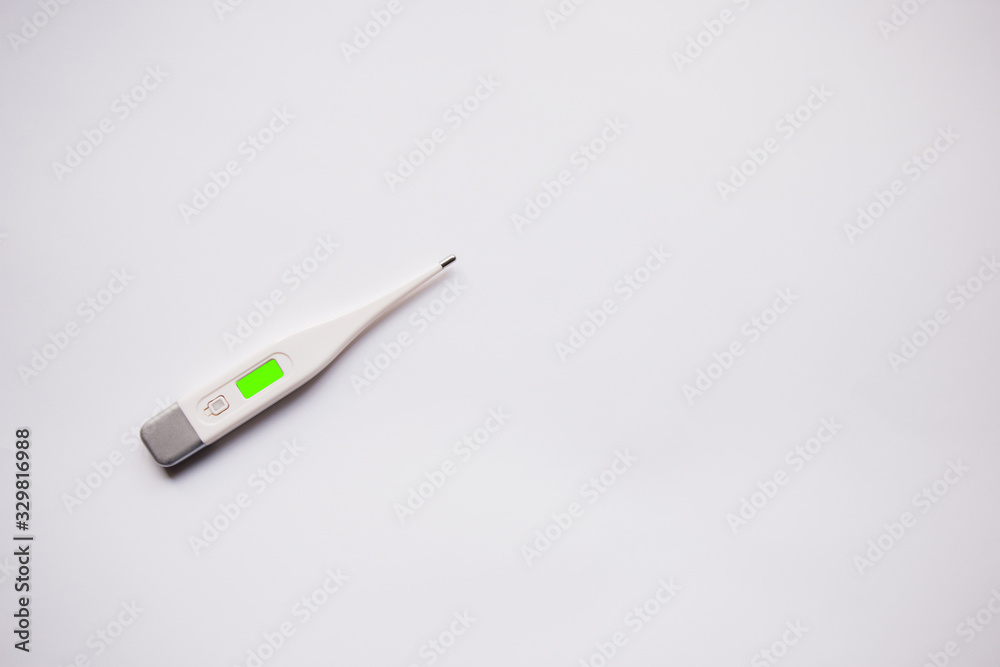 electronic thermometer on a white background electronic thermometer on a white background