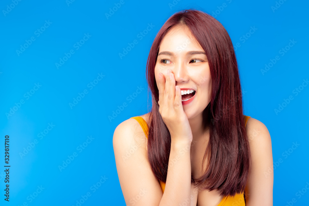 Cute young asian woman, lovely sense of humor with laughing Happy young lady standing isolated over blue background Portrait of gesturing good looking Asia woman laughing while looking aside. cheerful Cute young asian woman, lovely sense of humor with laughing Happy young lady standing isolated over blue background Portrait of gesturing good looking Asia woman laughing while looking aside. cheerful