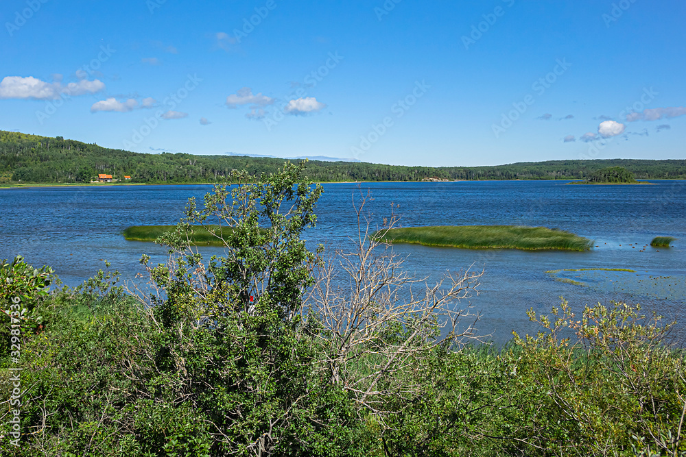 Picturesque view of Lake Matapedia (Lac Matapedia) shore near the city of Amqui in Quebec, Canada.
