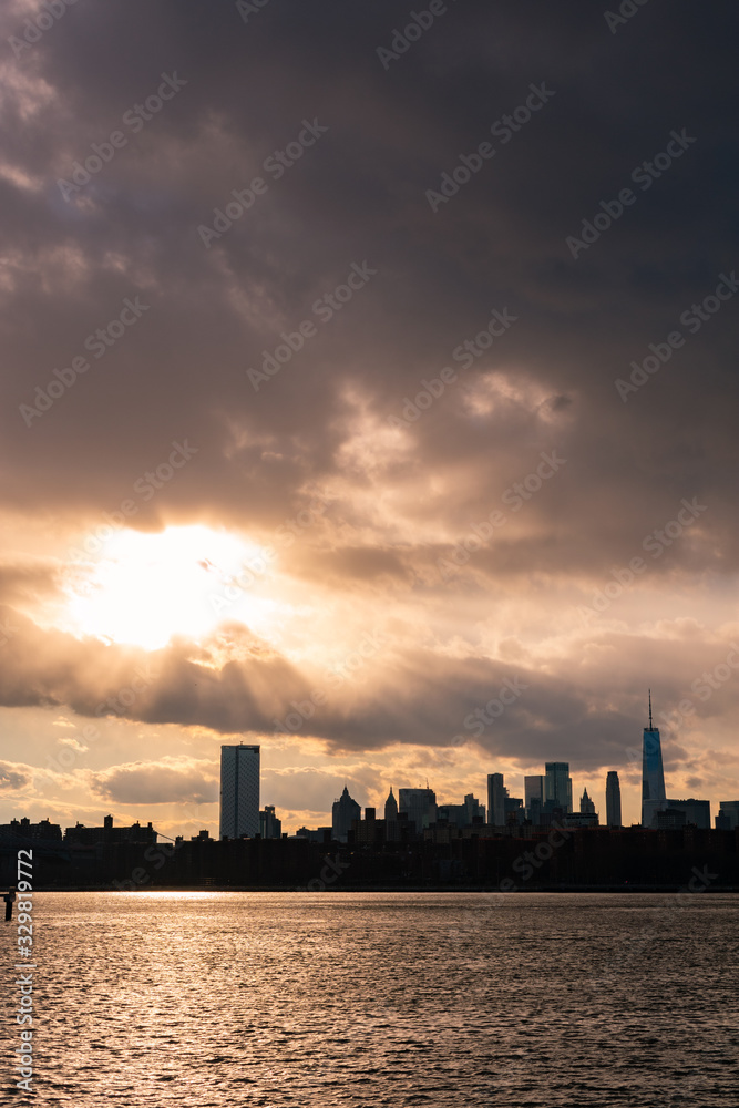 Lower Manhattan Skyline on the East River in New York City during Sunset Lower Manhattan Skyline on the East River in New York City during Sunset