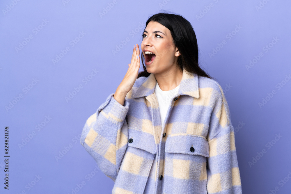 Young brunette woman over isolated purple background yawning and covering wide open mouth with hand Young brunette woman over isolated purple background yawning and covering wide open mouth with hand