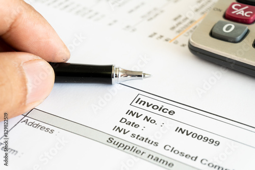 Invoice business document close up with pen background