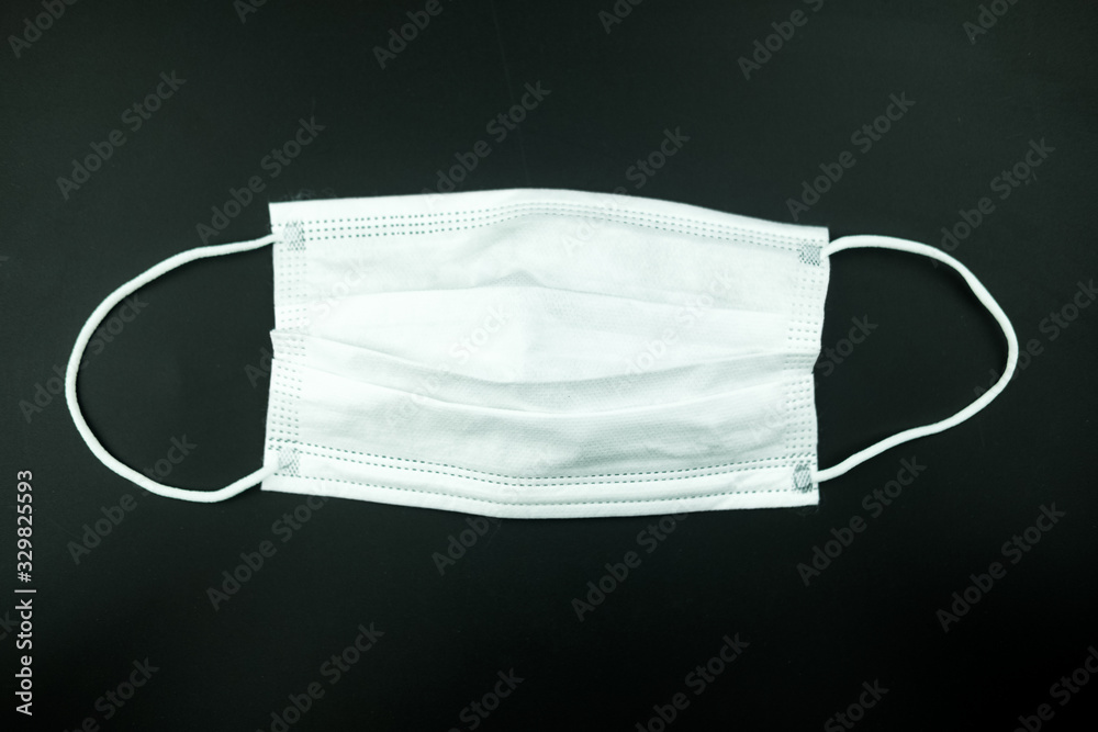 White mask protection for virus on black background White mask protection for virus on black background