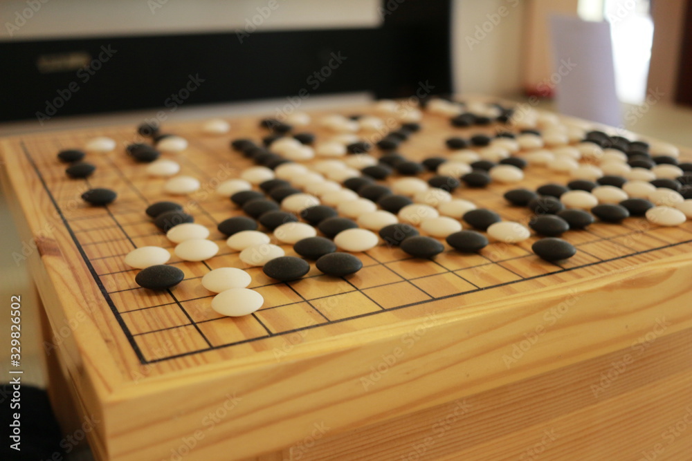 Checkers on a wooden board. Checkers are an activity that is a practice of thinking skills and good concentration. Checkers on a wooden board. Checkers are an activity that is a practice of thinking skills and good concentration.