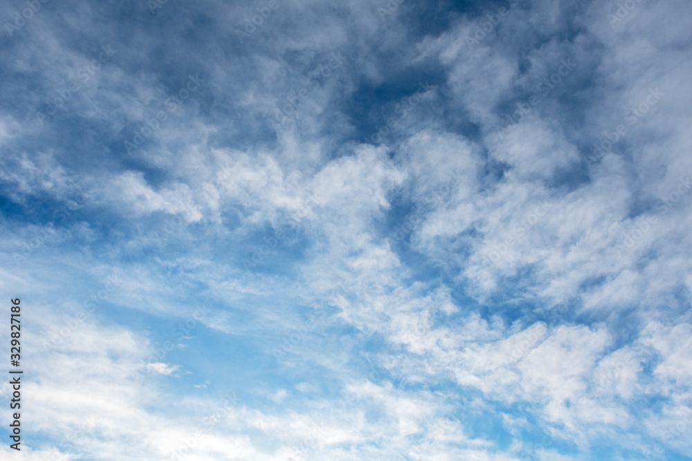 Backgrounds and textures. Blue beautiful sky with clouds.