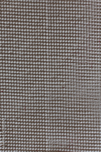  Texture of gypsum plaster on fiberglass mesh.