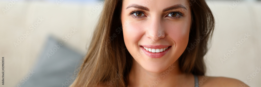 Close-up of wonderful woman holding pink plastic bottle of water. Beautiful sportswoman correcting figure with protein shake at home. Sport and fitness concept Close-up of wonderful woman holding pink plastic bottle of water. Beautiful sportswoman correcting figure with protein shake at home. Sport and fitness concept