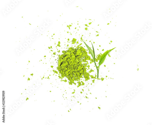 The tea leaves and ground tea are diffused and diffused. Isolated on a white background. Top view