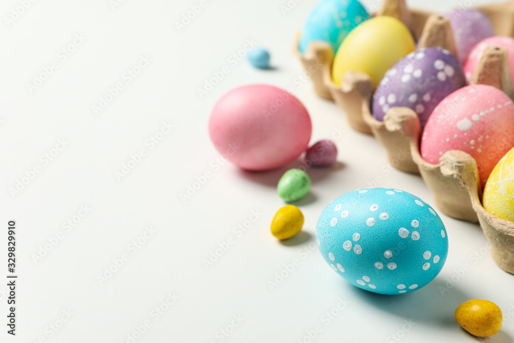 Multicolor Easter eggs on white background, space for text