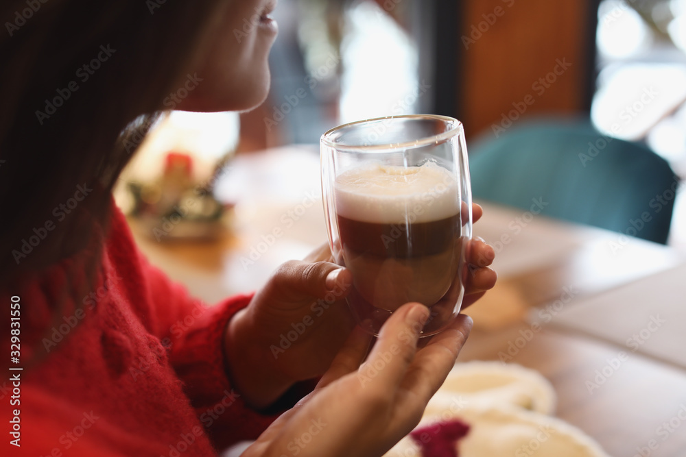 Woman with fresh morning coffee at table in cafe, closeup Woman with fresh morning coffee at table in cafe, closeup