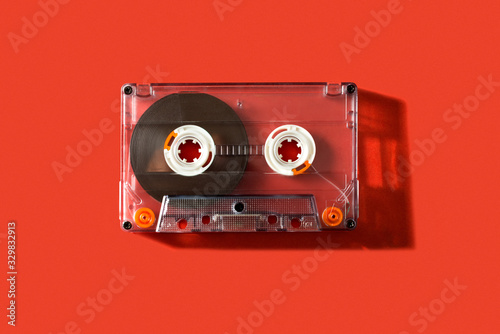 Fotografija Old vintage cassette tape on a red background