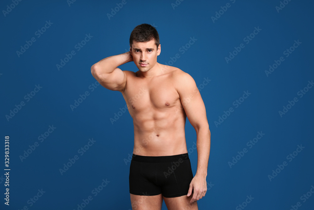 Man with sexy body on blue background