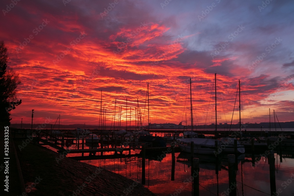marina with blood red sky at dawn
