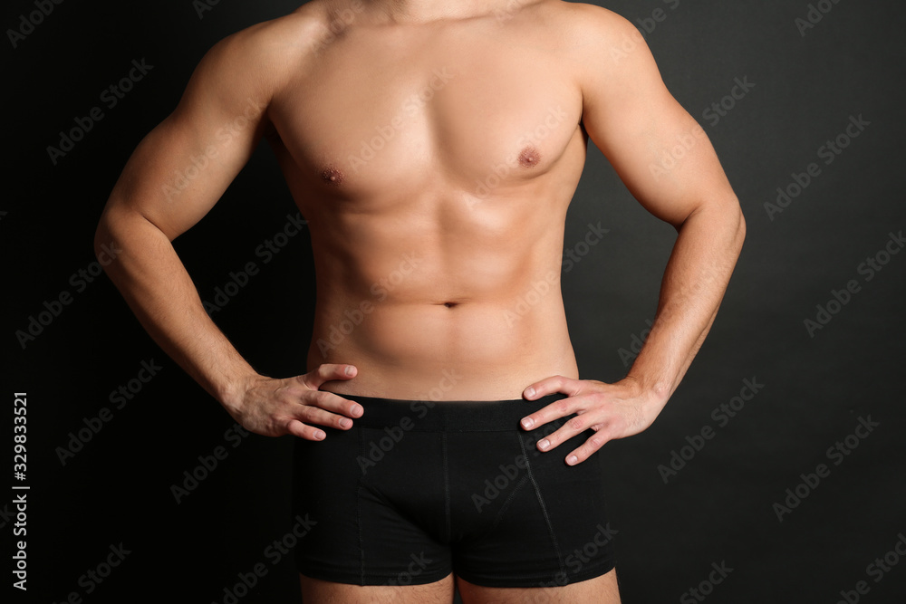 Man with sexy body on black background, closeup Man with sexy body on black background, closeup