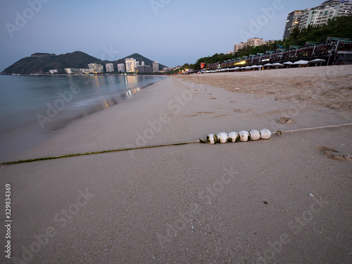 Beach as the sunset in Sanya, Hainan, China. photo