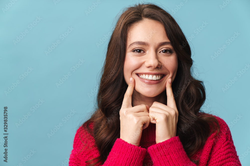 Photo of caucasian happy woman with long brown hair smiling at camera Photo of caucasian happy woman with long brown hair smiling at camera