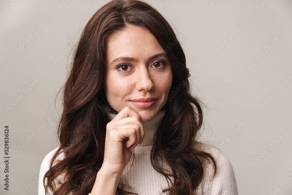 Photo of caucasian happy woman with long brown hair smiling at camera Photo of caucasian happy woman with long brown hair smiling at camera