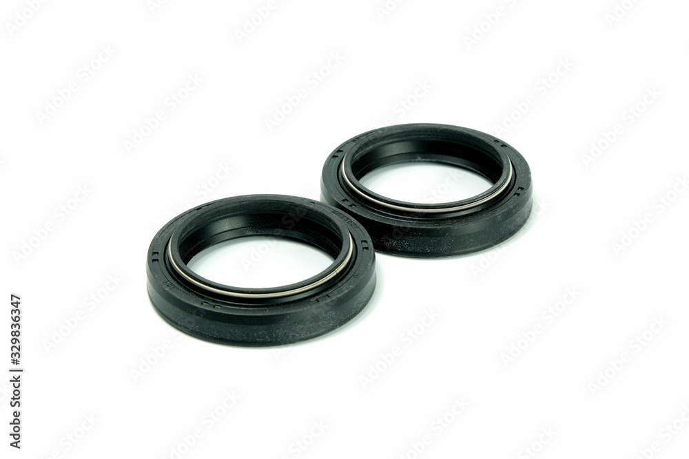 Spare part rubber seal for motorcycle fork.on a isolated white background. Motorcycle service. Spare part rubber seal for motorcycle fork.on a isolated white background. Motorcycle service.