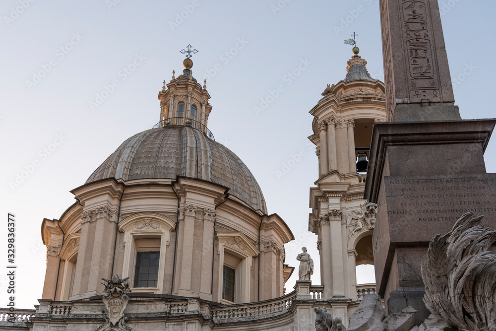The dome of the church of S.Agnese in Agone, Rome, Italy. The Agonal obelisk, made of granite. Famous monuments of Baroque Rome.