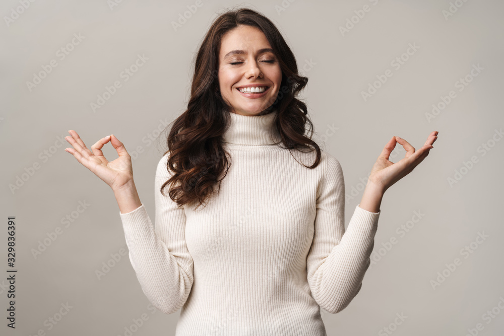 Photo of caucasian beautiful woman meditating and gesturing fingers Photo of caucasian beautiful woman meditating and gesturing fingers