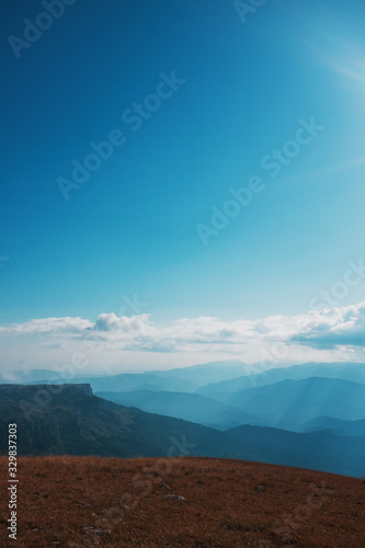 Landscapes with blue sky and clouds  Route through the mountain peaks and hills through the majestic