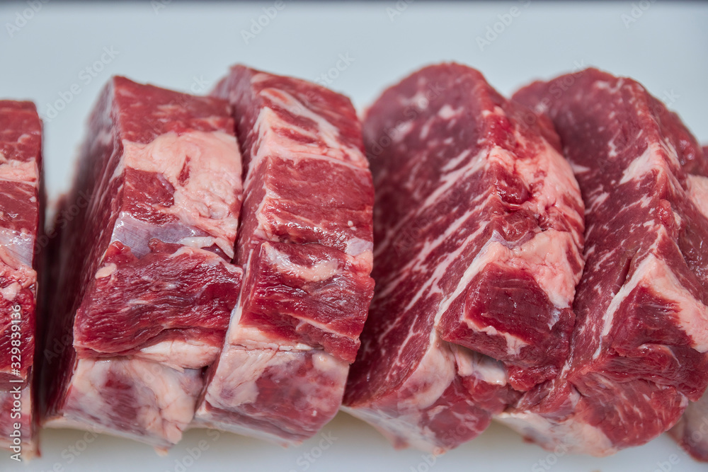 sliced beef steaks closeup. raw beef for grilling.
