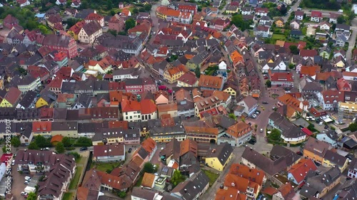 Wallpaper Mural Aerial view of the old town of Ettenheim in Germany on a cloudy day in the afternoon. Pan to the left across the town and zoom out. Torontodigital.ca