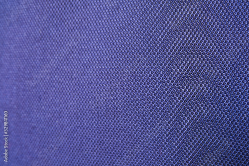 Close up shot of midnight dark blue formal suit cloth textile surface. wool fabric texture for important luxury evening or night event. Wallpaper and background with copy space for text