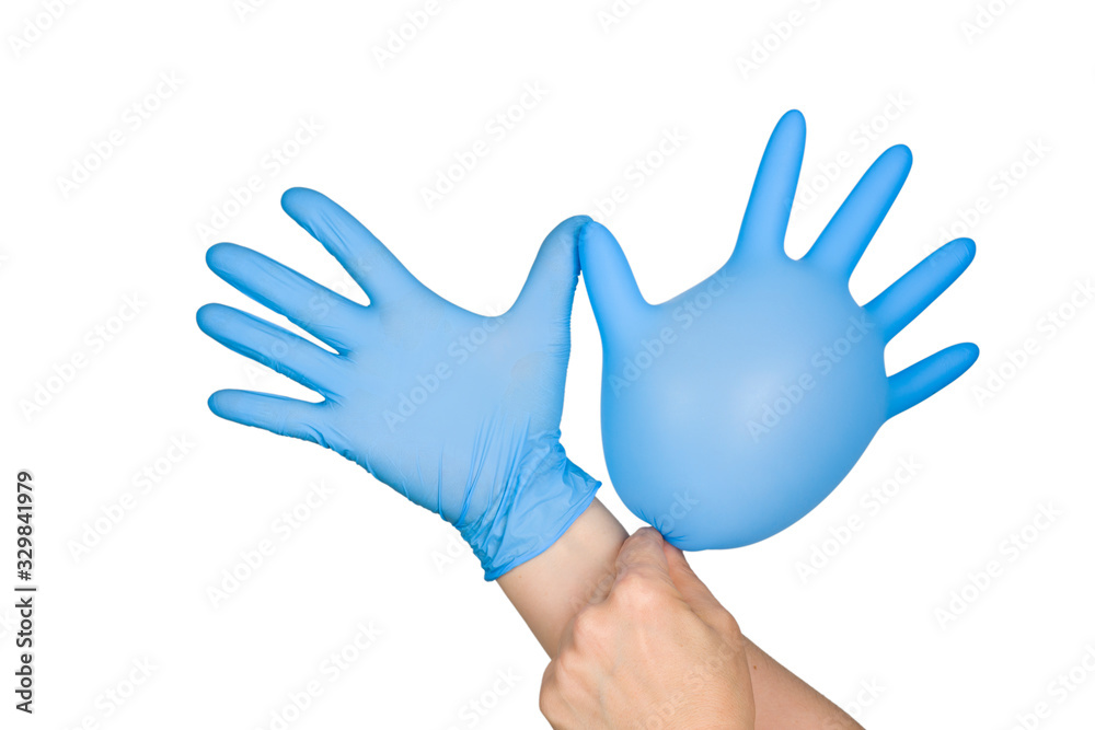 Obraz premium Lymphedema: Symptoms, treatments, and causes concept - Hand putting on blue glove, isolated on white background