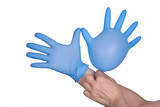 Lymphedema: Symptoms, treatments, and causes concept - Hand putting on blue glove, isolated on white background
