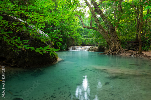 A beautiful waterfall deep in the tropical forest  steep mountain adventure in the rainforest.