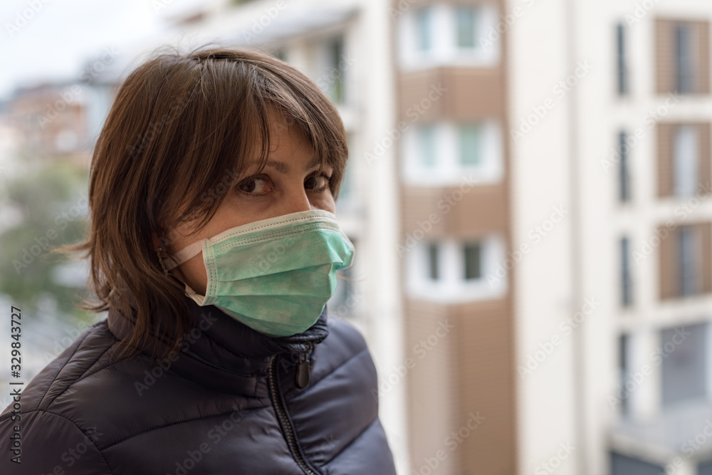 Woman wearing medical face mask for protection Woman wearing medical face mask for protection
